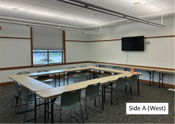 Photo of Community Meeting Room Side A with standard set-up of tables in a square with chairs