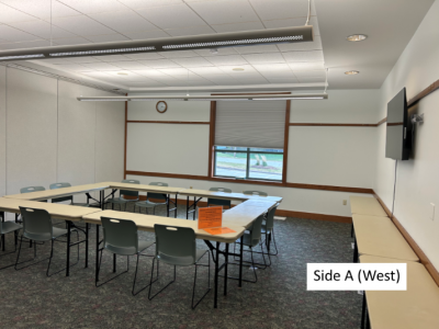 Photo of Community Meeting Room Side A with standard set-up, divider wall shown in background
